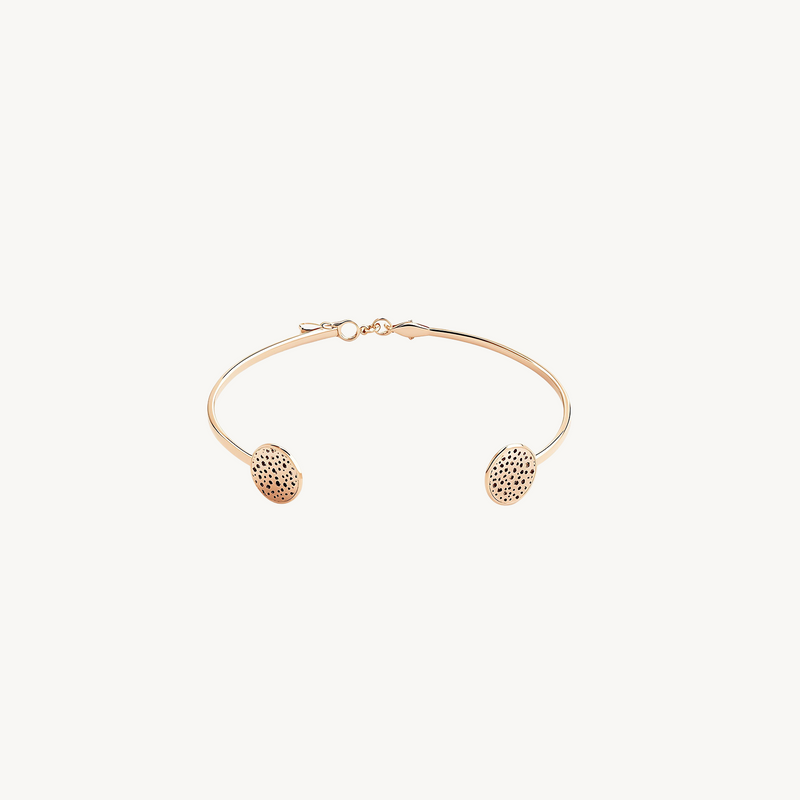 Golden Twin Disc Bracelet front view with two patterned circular motifs